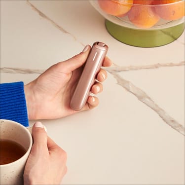 Ploom AURA front panel Rose Gold accessory attached to device.